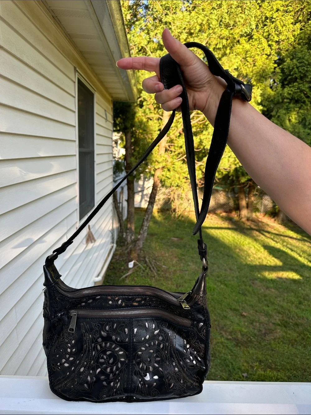 Patricia Nash Black Floral Cutout Crossbody with Tassel Accent